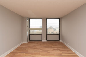 Unit Bedroom, 2 large windows, wood floors, view of downtown chicago.