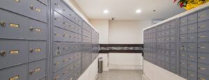 Interior mail-room, Cluster mailbox units, security cameras.